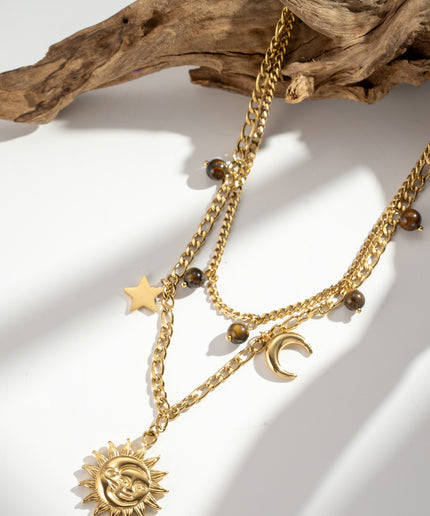 Collier doré multi-charms soleil lune étoile œil de tigre